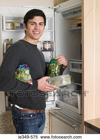 Man by refrigerator View Large Photo Image Stock Photography - Man by refrigerator. Fotosearch
