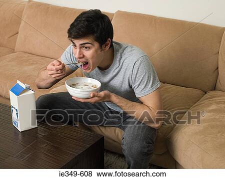 Man having breakfast View Large Photo Image Stock Photo - Man having breakfast. Fotosearch