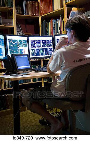 Man looking at graphs View Large Photo Image Stock Image - Man looking at graphs. Fotosearch