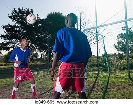 Men playing football View Large Photo Image Stock Photography - Men playing football. Fotosearch