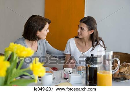 Mother and daughter at breakfast View Large Photo Image Stock Photo - Mother and daughter at breakfast. Fotosearch