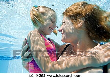 Mother and daughter in pool View Large Photo Image Stock Photo - Mother and daughter in pool. Fotosearch