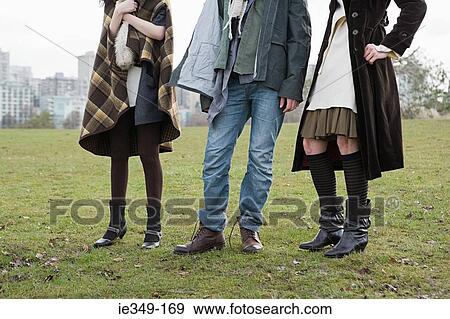 People standing in field View Large Photo Image Stock Photo - People standing in field. Fotosearch