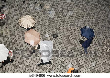People with umbrellas View Large Photo Image Stock Photograph - People with umbrellas. Fotosearch