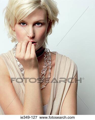 Portrait of a young woman View Large Photo Image Stock Photo - Portrait of a young woman. Fotosearch
