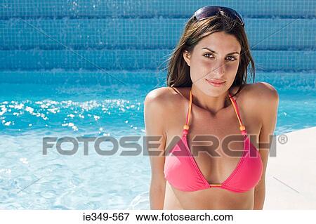Woman by swimming pool View Large Photo Image Stock Photo - Woman by swimming pool. Fotosearch
