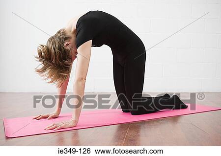Woman doing pilates View Large Photo Image Stock Photograph - Woman doing pilates. Fotosearch