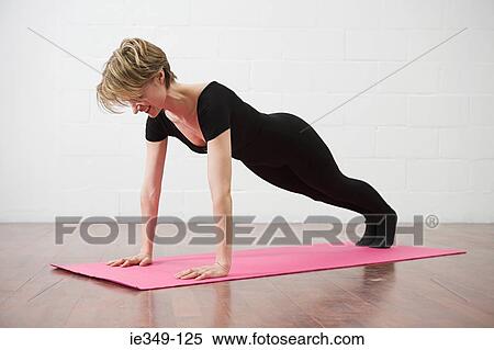 Woman doing pilates View Large Photo Image Stock Photography - Woman doing pilates. Fotosearch