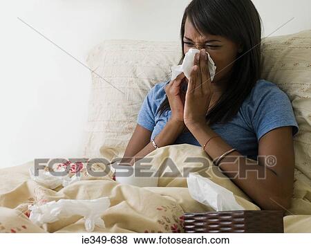 Woman in bed with cold View Large Photo Image Stock Photo - Woman in bed with cold. Fotosearch