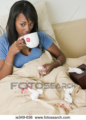 Woman in bed with cold View Large Photo Image Stock Photograph - Woman in bed with cold. Fotosearch
