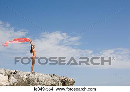 Woman stading on rocks View Large Photo Image Picture - Woman stading on rocks. Fotosearch