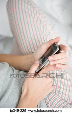 Stock Photography - Woman with cellphone. Fotosearch