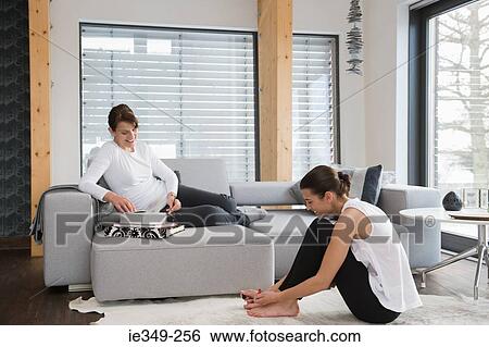 Stock Photograph - Women relaxing at home. Fotosearch