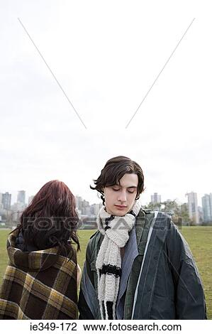 Young couple outdoors View Large Photo Image Stock Image - Young couple outdoors. Fotosearch