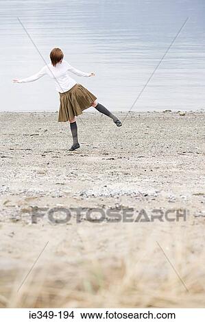 Picture - Young woman by the sea. Fotosearch