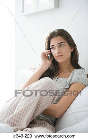 Young woman with cellphone View Large Photo Image Stock Image - Young woman with cellphone. Fotosearch