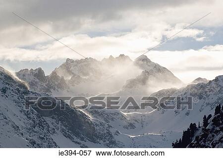 Clouds and mountain peaks View Large Photo Image Stock Photo - Clouds and mountain peaks. Fotosearch