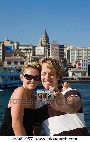Couple photographing themselves in galata View Large Photo Image Stock Photo - Couple photographing themselves in galata. Fotosearch