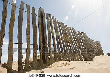 Fence on a beach View Large Photo Image Stock Photo - Fence on a beach. Fotosearch