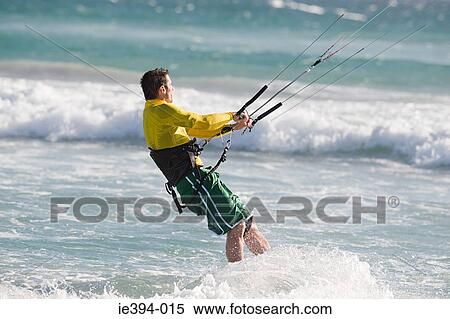 Stock Photography - Man kitesurfing. Fotosearch
