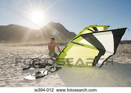 Man with kiteboard View Large Photo Image Stock Image - Man with kiteboard. Fotosearch