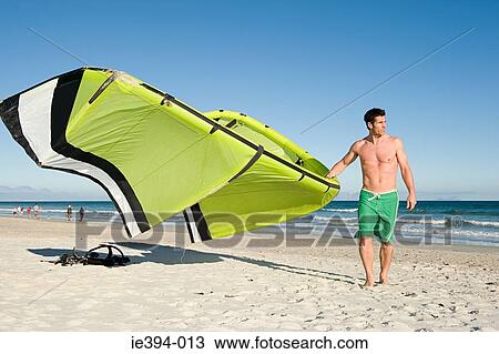 Man with kiteboard View Large Photo Image Stock Image - Man with kiteboard. Fotosearch