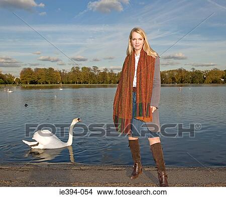 Woman by a lake View Large Photo Image Picture - Woman by a lake. Fotosearch