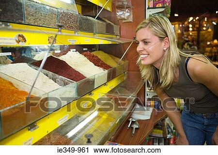 Young woman at spice bazaar View Large Photo Image Stock Image - Young woman at spice bazaar. Fotosearch