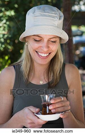 Young woman with tea View Large Photo Image Stock Image - Young woman with tea. Fotosearch