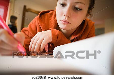 A girl doing a homework View Large Photo Image Stock Photo - A girl doing a homework. Fotosearch