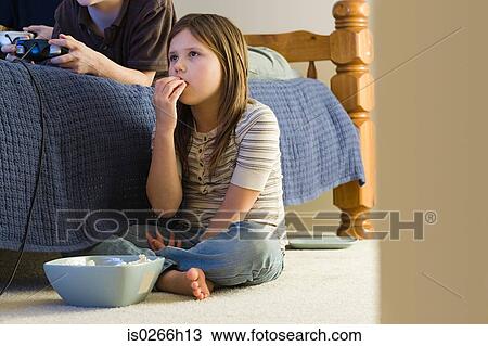 A girl eating popcorn View Large Photo Image Stock Image - A girl eating popcorn. Fotosearch