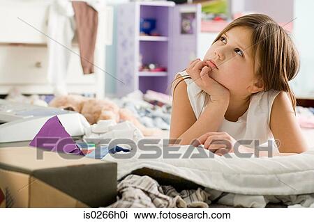 Stock Image - A girl thinking. Fotosearch