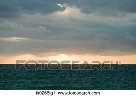 Sunset over an ocean View Large Photo Image Stock Image - Sunset over an ocean. Fotosearch