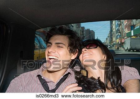 A couple in the back of a taxi View Large Photo Image Stock Image - A couple in the back of a taxi. Fotosearch