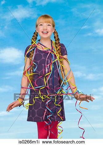A girl covered in streamers View Large Photo Image Stock Image - A girl covered in streamers. Fotosearch
