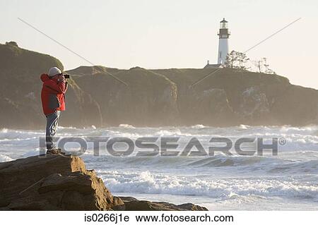 A man photographing the sea View Large Photo Image Stock Image - A man photographing the sea. Fotosearch