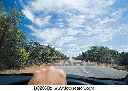 A person driving a car View Large Photo Image Stock Photo - A person driving a car. Fotosearch
