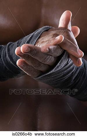 A young man rubbing his hands with chalk View Large Photo Image Stock Image - A young man rubbing his hands with chalk. Fotosearch