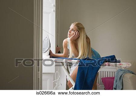 Bored woman with ironing View Large Photo Image Stock Image - Bored woman with ironing. Fotosearch