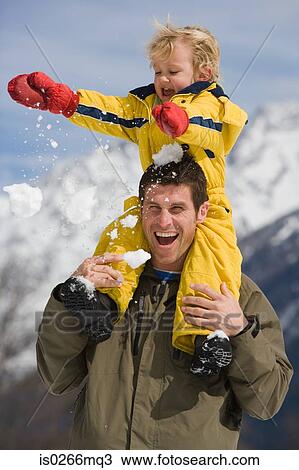 Stock Image - Boy on fathers shoulders. Fotosearch