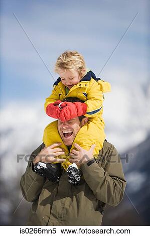 Boy on fathers shoulders View Large Photo Image Stock Photography - Boy on fathers shoulders. Fotosearch