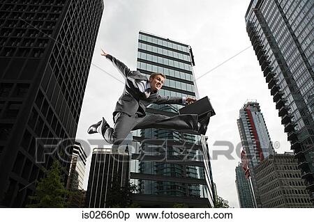 Stock Photography - Businessman jumping. Fotosearch