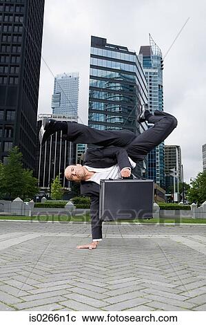 Businessman practising capoeira View Large Photo Image Stock Image - Businessman practising capoeira. Fotosearch