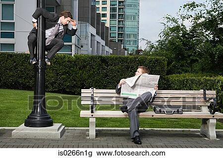Businessman spying on colleague View Large Photo Image Stock Image - Businessman spying on colleague. Fotosearch