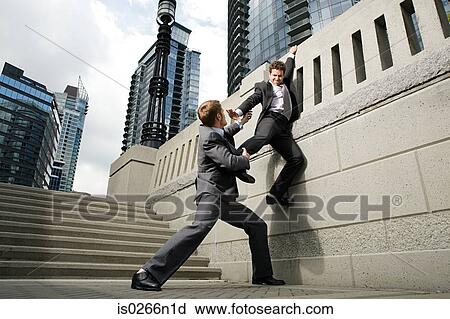 Stock Image - Businessman trying to escape. Fotosearch