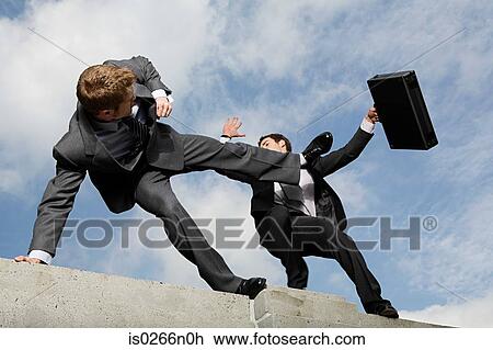 Stock Image - Businessmen fighting. Fotosearch