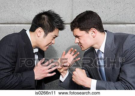 Stock Image - Businessmen fighting. Fotosearch