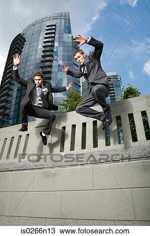 Businessmen jumping View Large Photo Image Stock Image - Businessmen jumping. Fotosearch