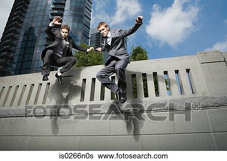 Businessmen jumping View Large Photo Image Stock Photograph - Businessmen jumping. Fotosearch