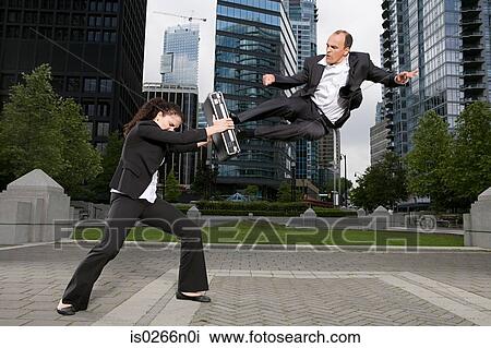 Businesspeople practising capoeira View Large Photo Image Stock Image - Businesspeople practising capoeira. Fotosearch